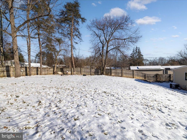 view of yard layered in snow