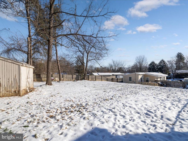 view of yard covered in snow