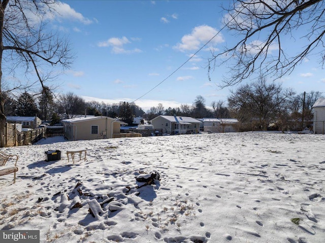 view of yard layered in snow