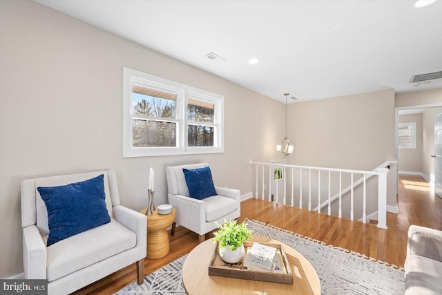 sitting room with hardwood / wood-style floors