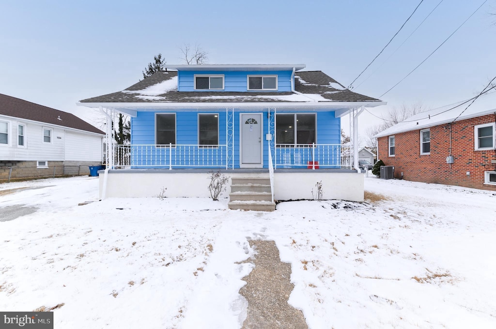 bungalow-style house featuring central AC and a porch