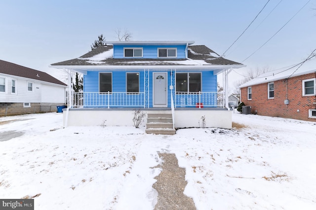 bungalow-style house featuring central AC and a porch