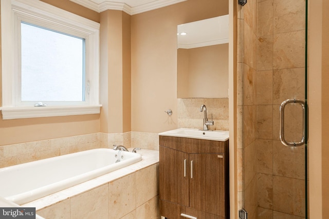 bathroom featuring vanity, ornamental molding, and independent shower and bath