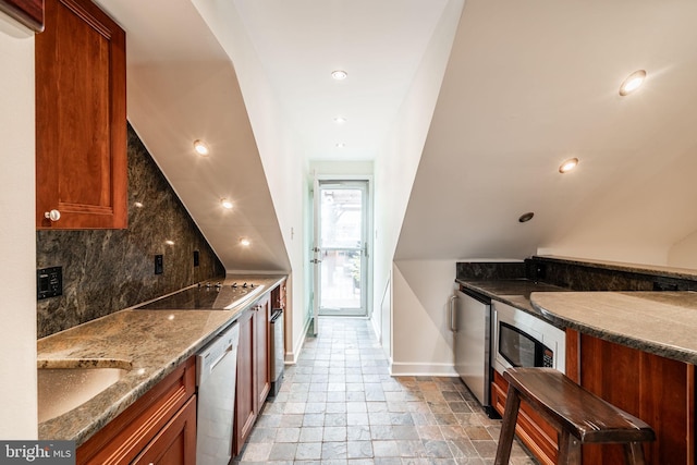 kitchen with sink, wall oven, black electric cooktop, dishwasher, and dark stone counters