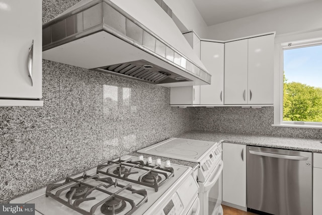 kitchen with white cabinets, dishwasher, white range with electric stovetop, and premium range hood