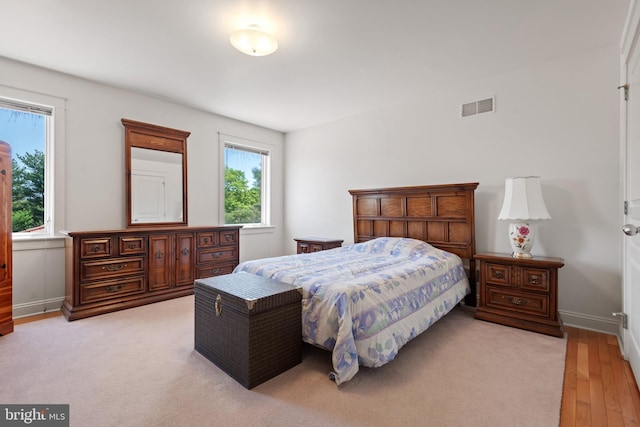 bedroom with light hardwood / wood-style flooring