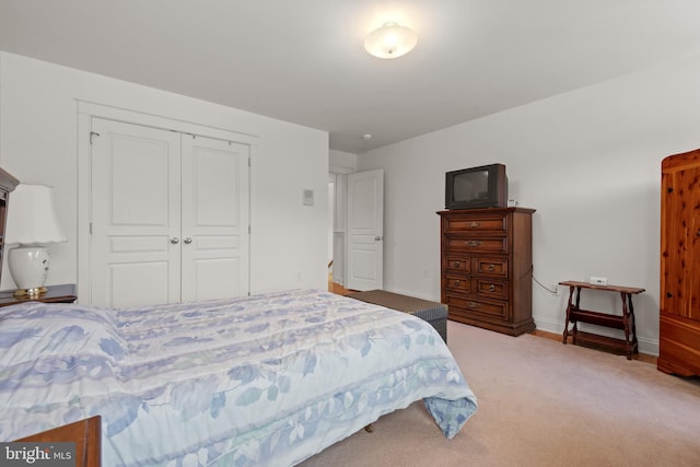 carpeted bedroom featuring a closet