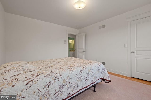 bedroom with light wood-type flooring