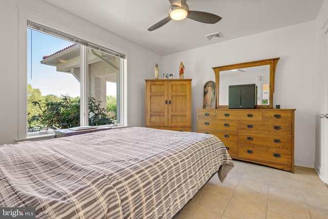 bedroom featuring ceiling fan and light tile patterned floors