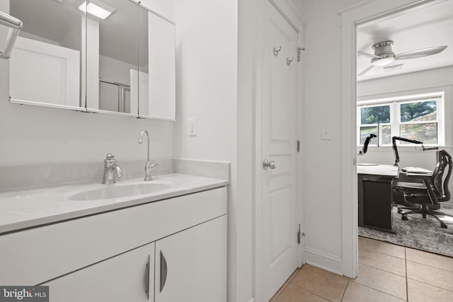 bathroom with ceiling fan, vanity, and tile patterned flooring