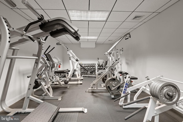 workout area with a paneled ceiling