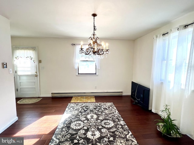 dining space featuring baseboard heating, plenty of natural light, dark hardwood / wood-style floors, and a chandelier