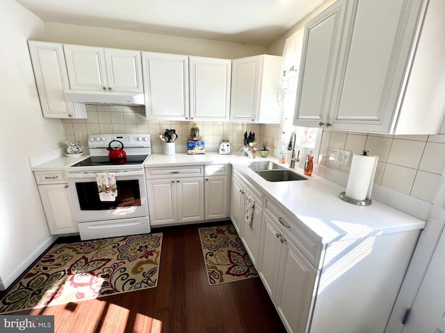 kitchen with sink, dark wood-type flooring, white cabinetry, backsplash, and white electric stove