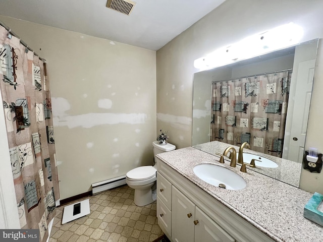 bathroom with a baseboard radiator, vanity, and toilet