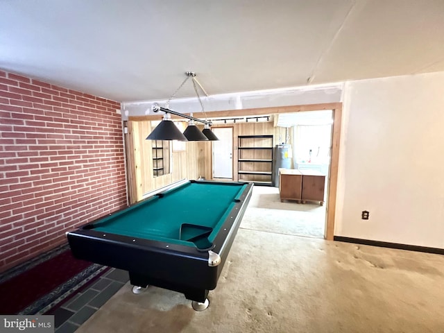 recreation room with carpet floors, brick wall, electric water heater, and billiards