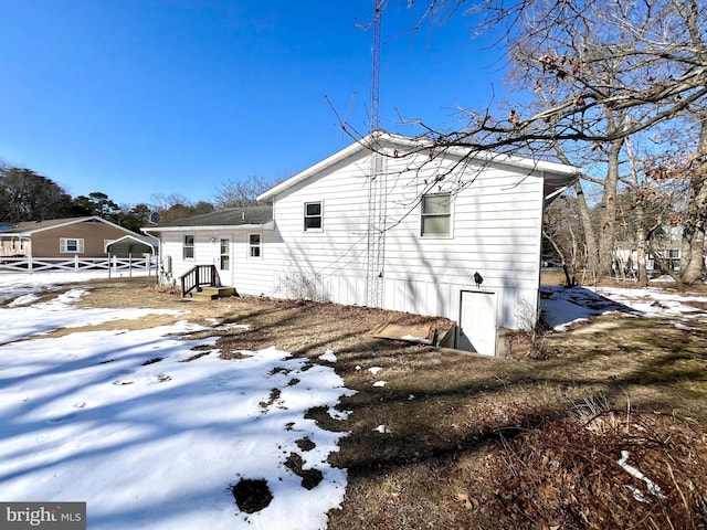 view of snow covered property