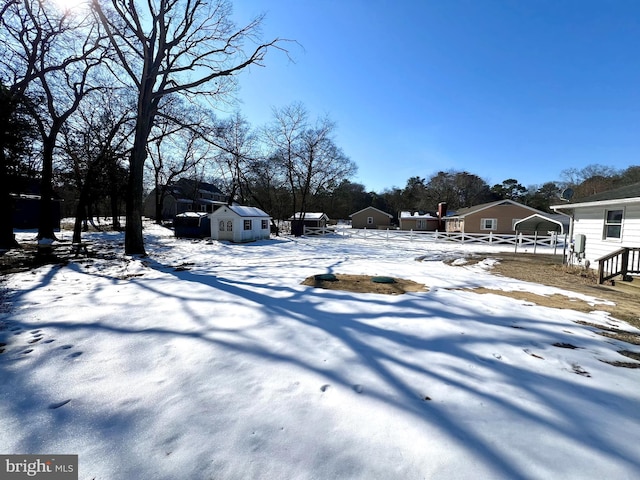 view of yard layered in snow