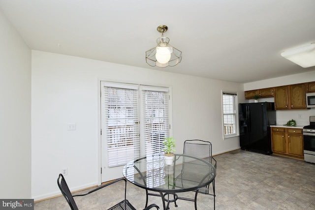 dining room featuring baseboards