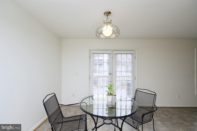 dining room featuring baseboards