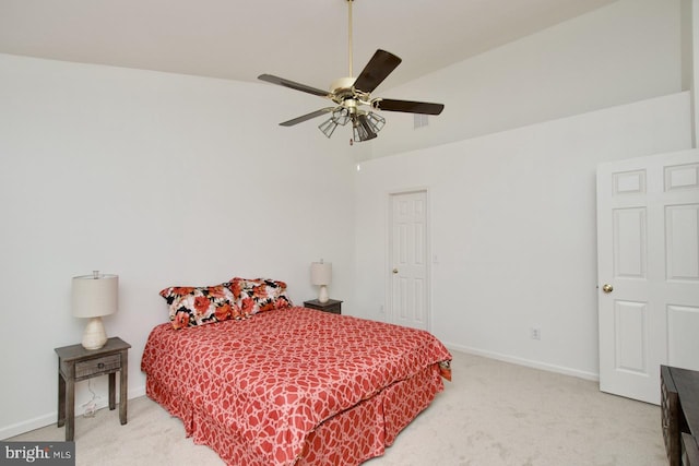 bedroom featuring a ceiling fan, light colored carpet, and baseboards