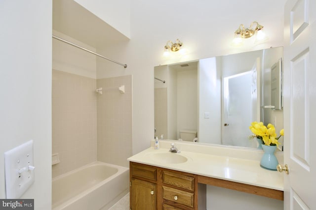 bathroom featuring tub / shower combination, toilet, and vanity