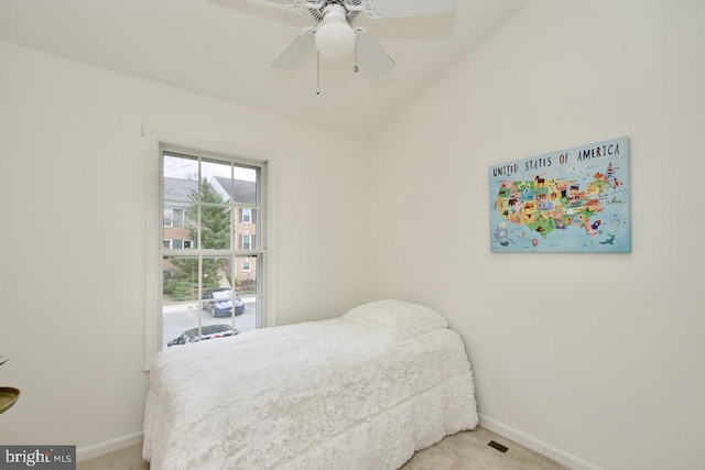 bedroom with a ceiling fan, baseboards, and carpet floors