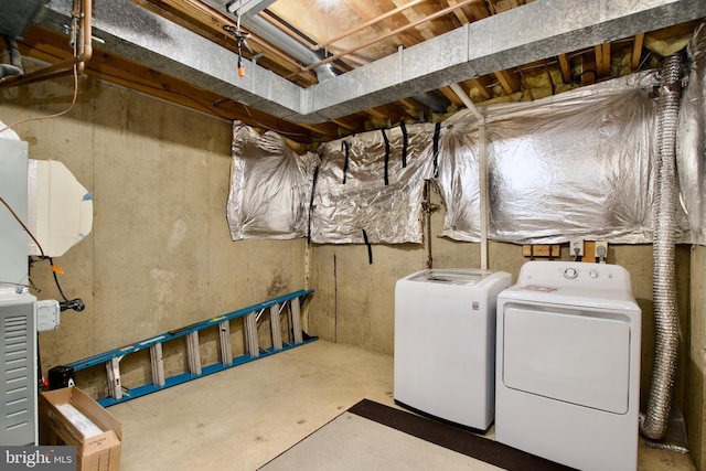 clothes washing area featuring laundry area and washing machine and clothes dryer