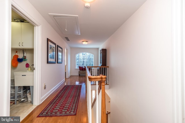 hall with wood-type flooring