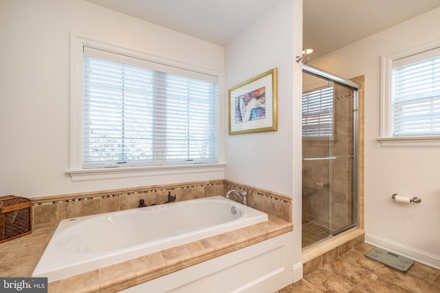 bathroom with tile patterned flooring and plus walk in shower