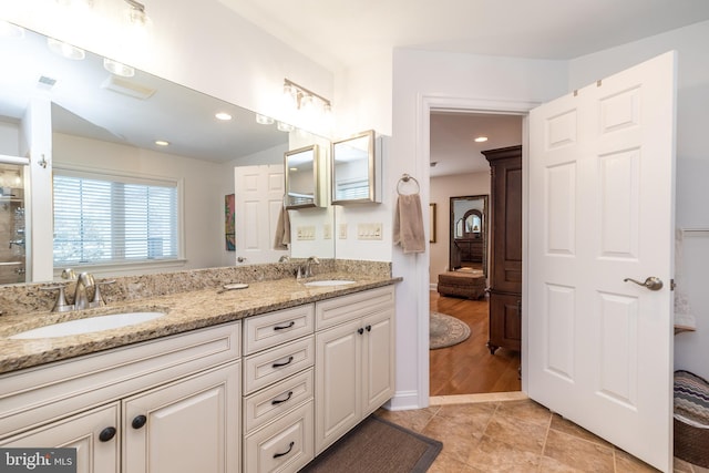 bathroom with vanity and tile patterned flooring