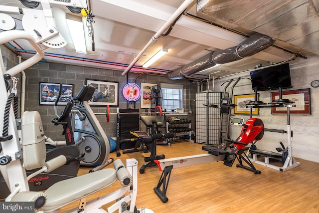 exercise area featuring hardwood / wood-style flooring