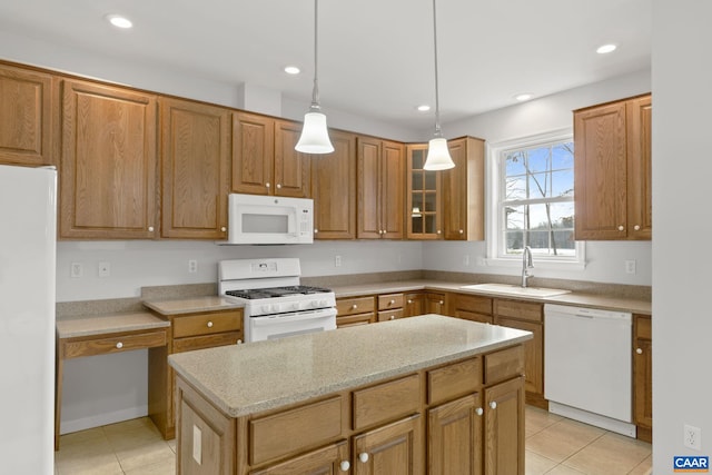 kitchen featuring sink, hanging light fixtures, light tile patterned floors, white appliances, and light stone countertops