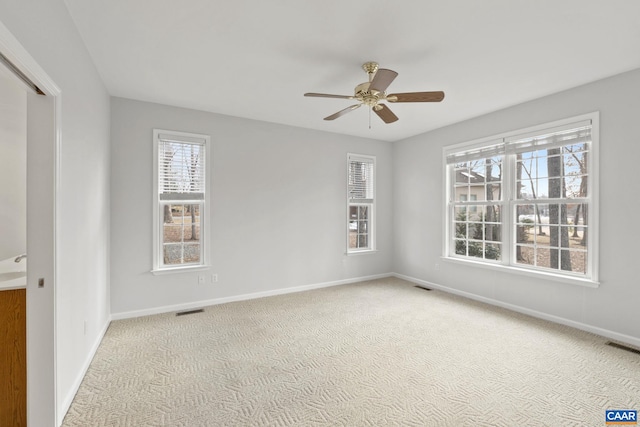 carpeted empty room with ceiling fan