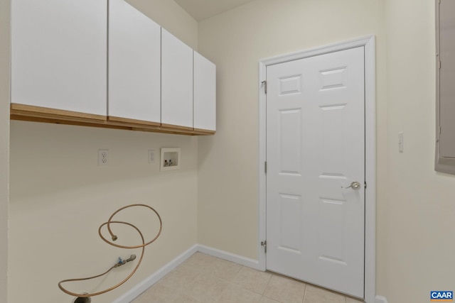 clothes washing area featuring cabinets and washer hookup