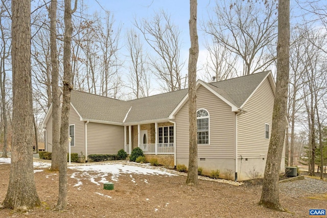 single story home featuring central AC unit and covered porch