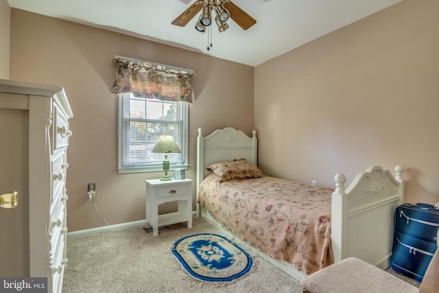 bedroom featuring ceiling fan and light colored carpet