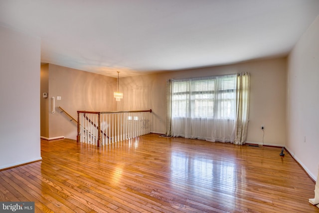 spare room featuring light hardwood / wood-style flooring