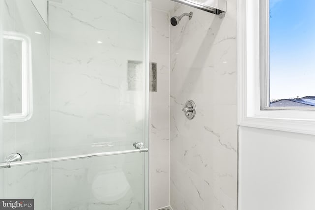 bathroom featuring walk in shower