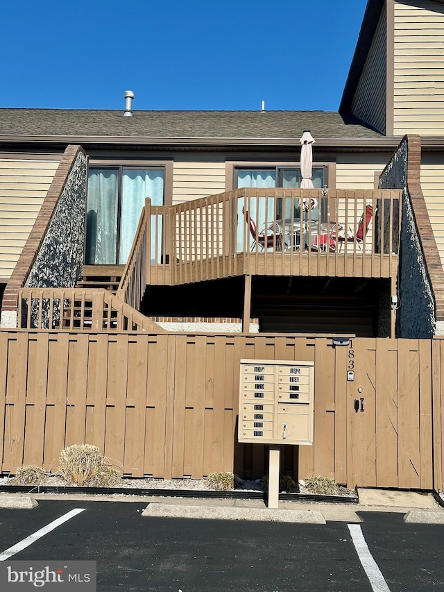 view of front of house featuring a balcony