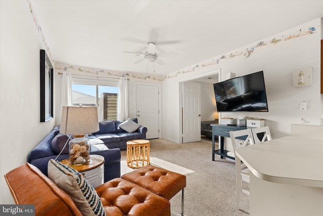 carpeted living room featuring ceiling fan