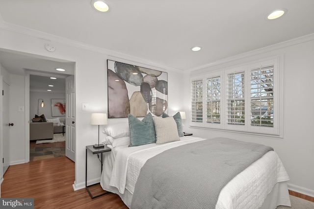 bedroom featuring crown molding and hardwood / wood-style floors