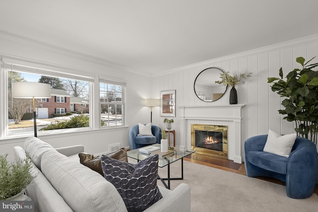 living room featuring hardwood / wood-style flooring and ornamental molding