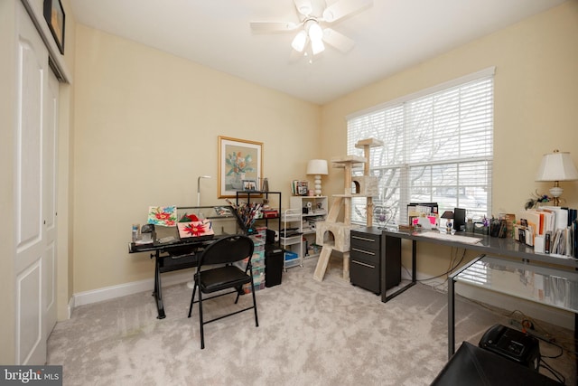 office with ceiling fan and light colored carpet