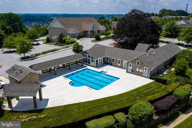 view of swimming pool with a patio area