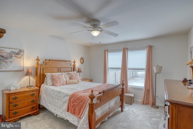 bedroom with light carpet and ceiling fan