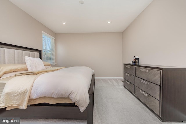 bedroom featuring light colored carpet