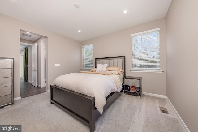 bedroom with light colored carpet