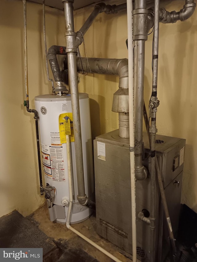 utility room featuring gas water heater