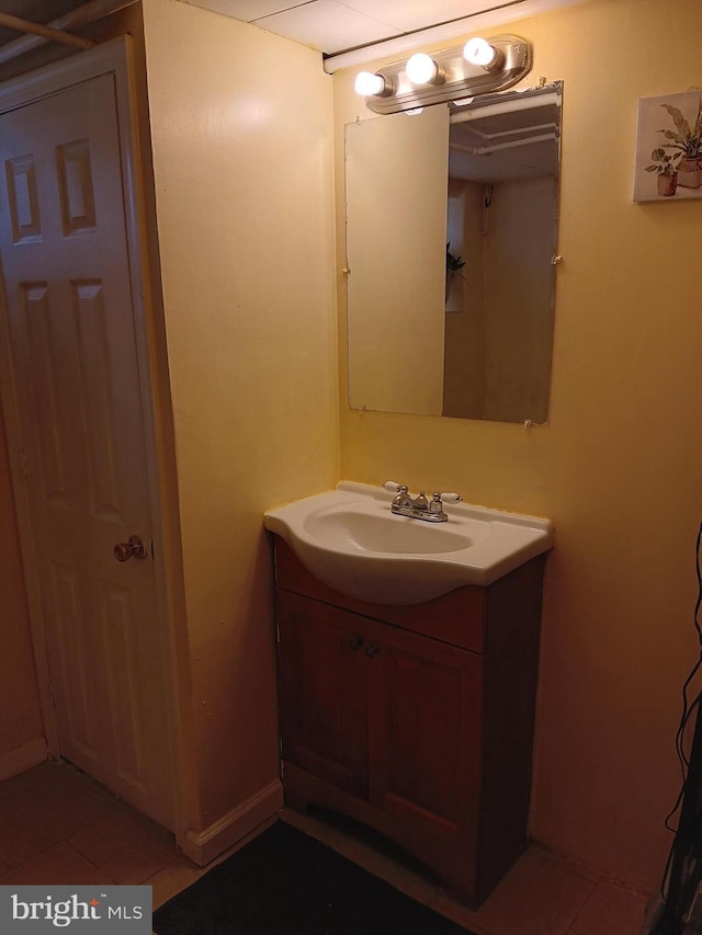 bathroom featuring tile patterned flooring and vanity