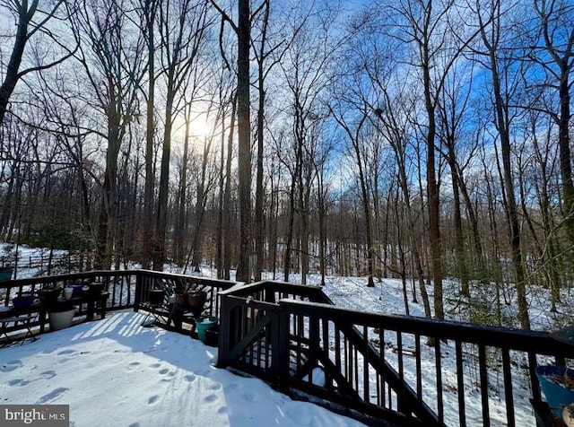 view of snow covered deck